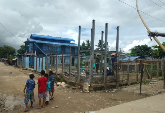 The school and water tower under construction